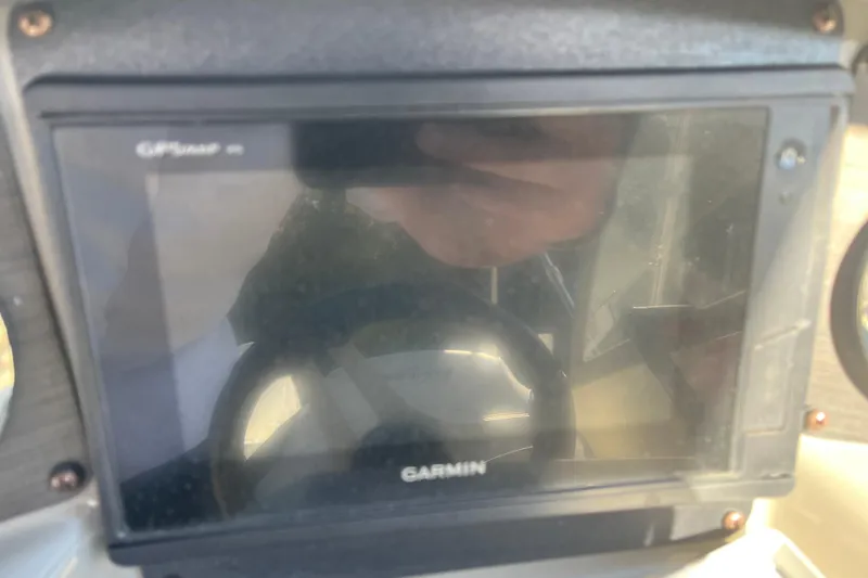 Slide: The Image of Garmin GPS display on 2020 Stingray 201DS boat dashboard. - 34