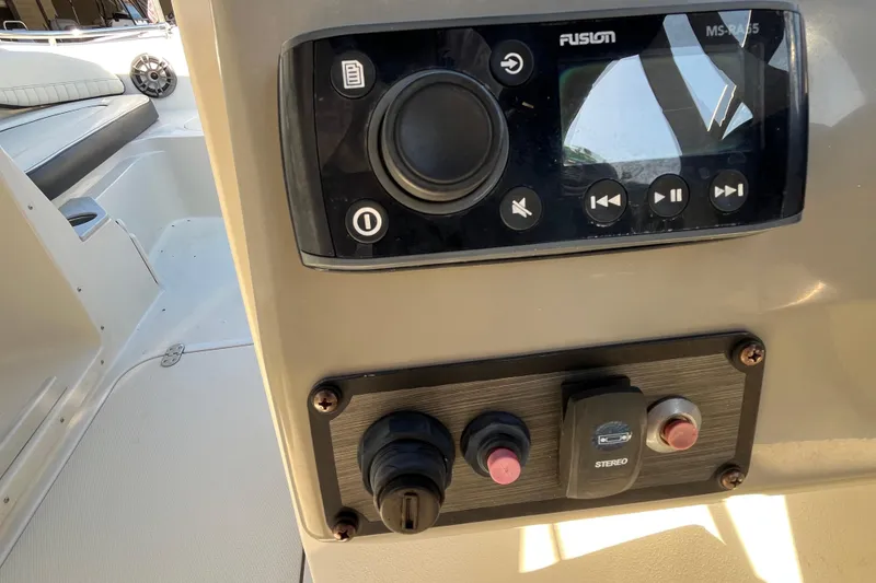 Slide: The Image of Control panel of a 2020 Stingray 201DS boat with stereo system. - 35