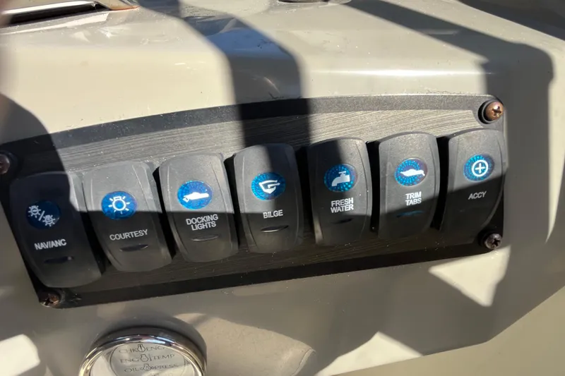 Slide: The Image of Control panel of a 2020 Stingray 201DS boat with labeled switches. - 36