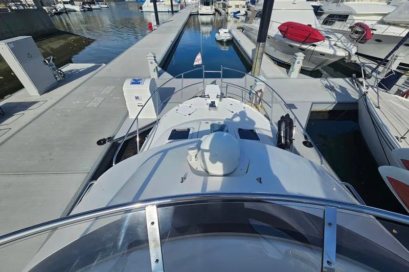 Slide: The Image of 2015 Cutwater 30 Command Bridge yacht docked at marina, viewed from above. - 21