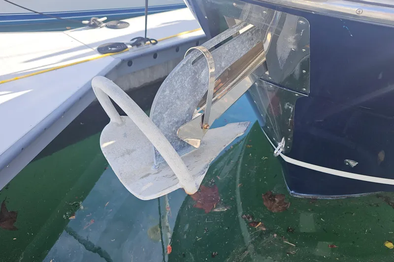 Slide: The Image of Anchor of a 2015 Cutwater 30 Command Bridge boat docked in marina. - 24