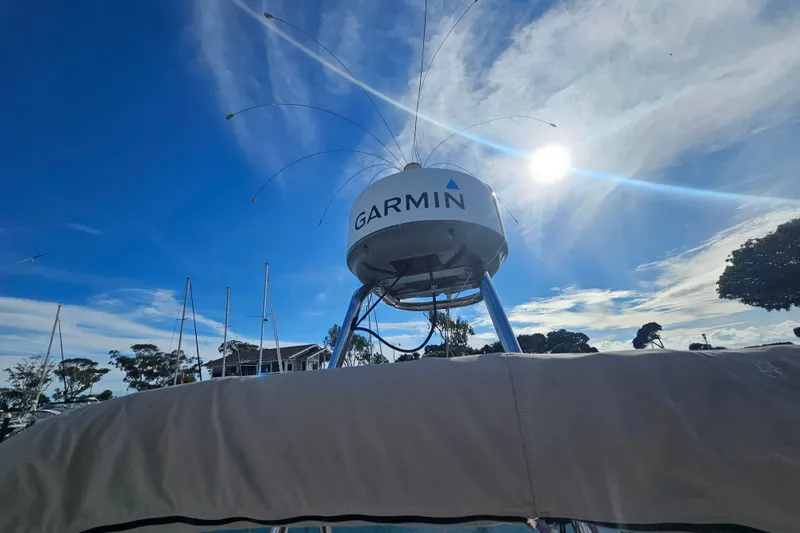 Slide: The Image of Cutwater 30 Command Bridge 2015 with Garmin radar under a bright blue sky. - 25