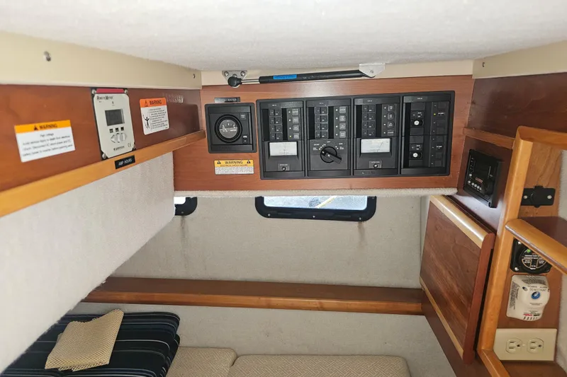 Slide: The Image of Interior view of 2015 Cutwater 30 Command Bridge with control panels and seating area. - 43