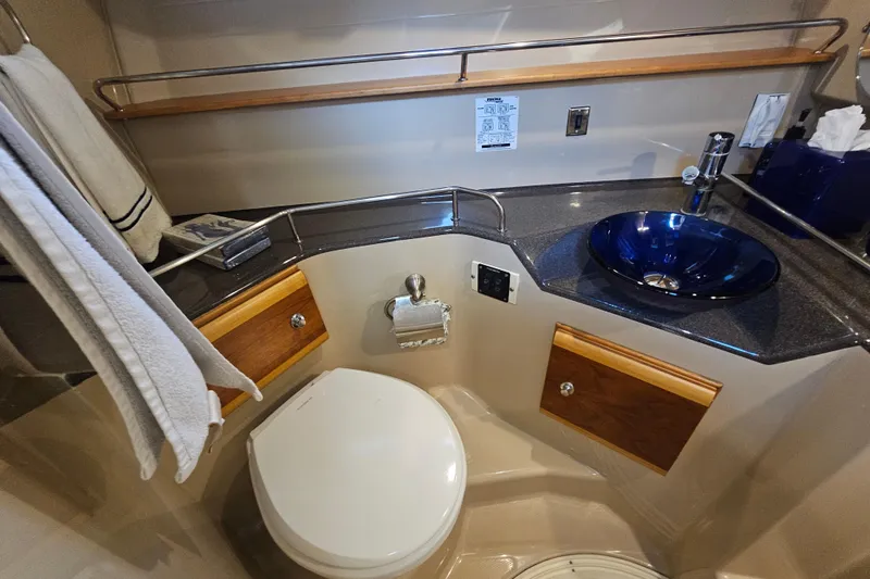 Slide: The Image of 2015 Cutwater 30 Command Bridge bathroom with modern sink and toilet. - 49