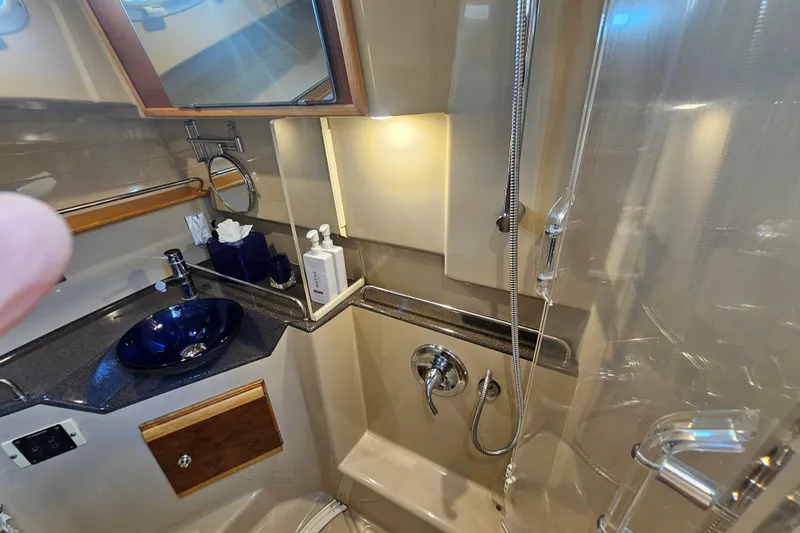 Slide: The Image of Luxurious bathroom in 2015 Cutwater 30 Command Bridge yacht with modern fixtures. - 51