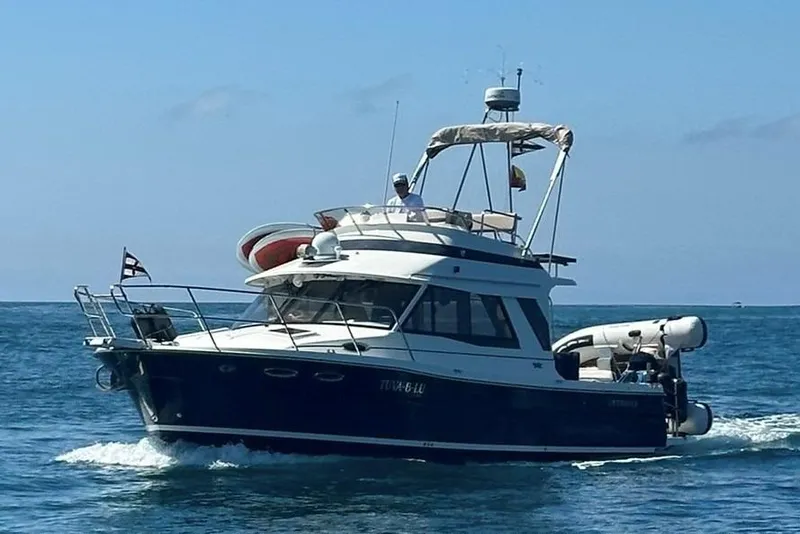 Slide: The Image of 2015 Cutwater 30 Command Bridge cruising on open water under clear skies. - 65