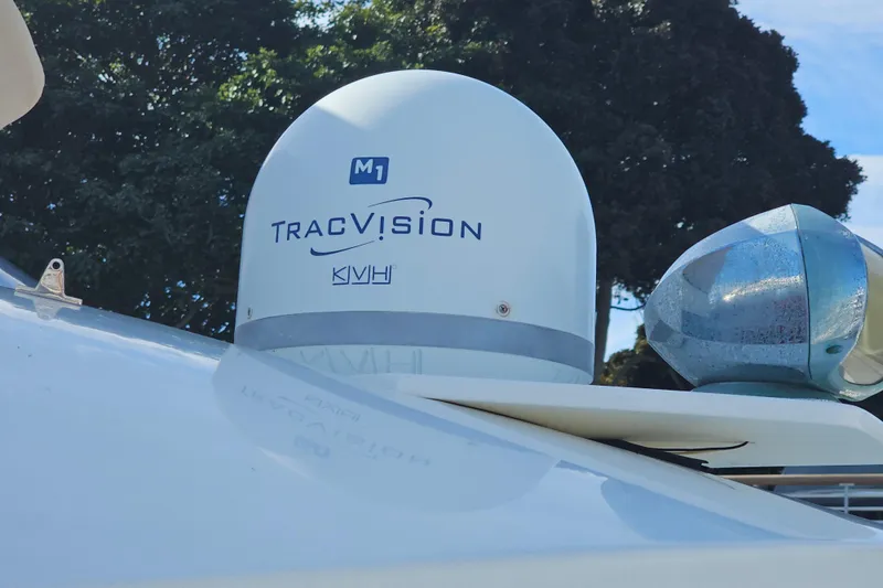 Slide: The Image of TracVision M1 satellite dome on 2015 Cutwater 30 Command Bridge boat, outdoor setting. - 8
