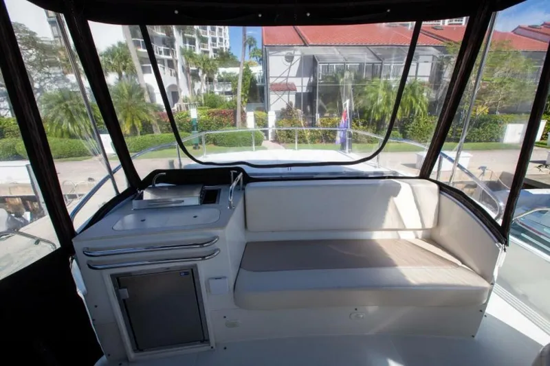 Slide: The Image of Interior view of 2012 Carver Sojourn yacht with seating and kitchenette. - 14