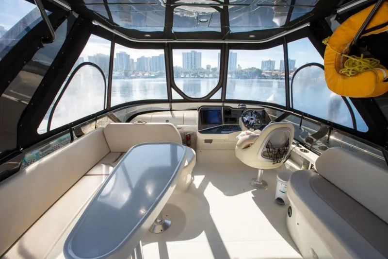 Slide: The Image of Luxurious 2012 Carver Sojourn yacht interior with panoramic windows and modern seating. - 15