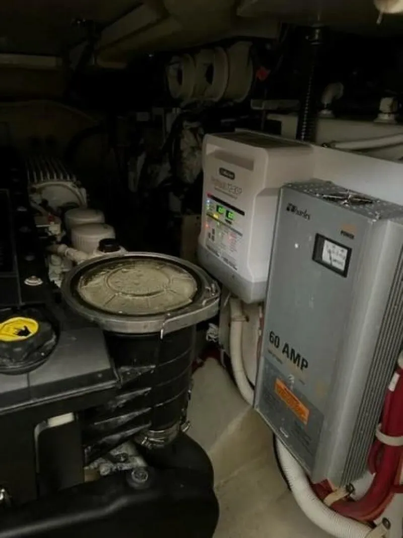 Slide: The Image of Engine room of a 2012 Carver Sojourn with electrical components and machinery. - 34