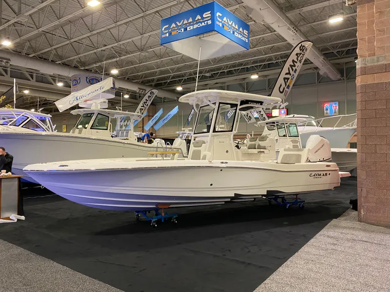 The Image of 2025 Caymas 26 HB boat displayed at an indoor boat show. - 1