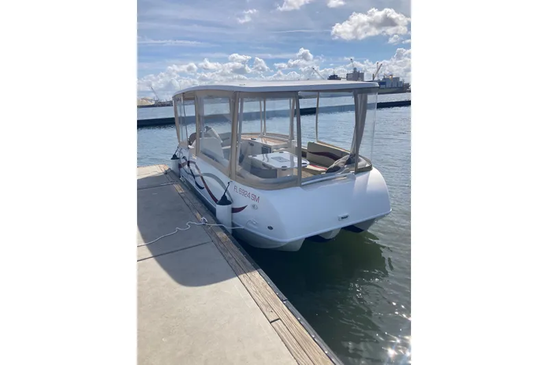 The Image of 2019 ElectraCraft 182TR electric boat docked on a sunny day. - 0