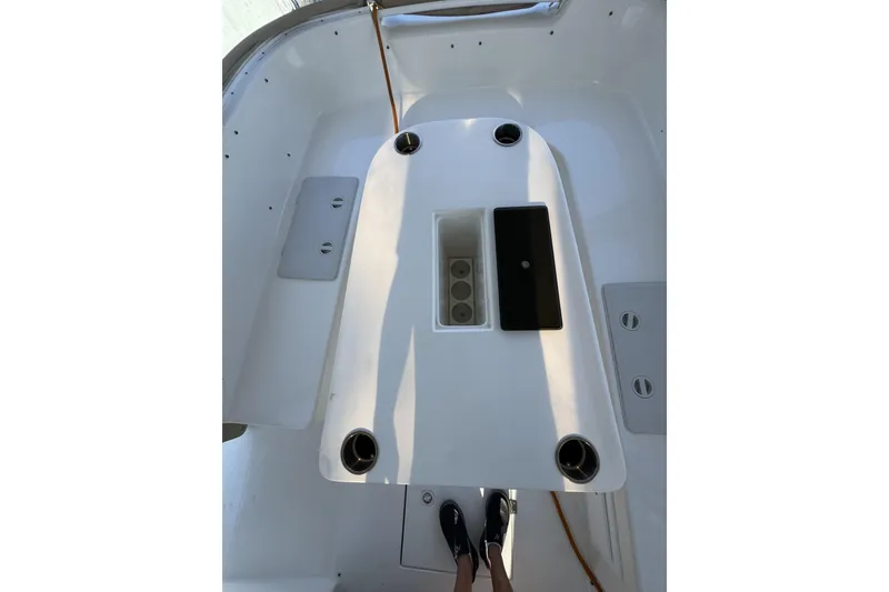 Slide: The Image of 2019 ElectraCraft 182TR boat interior with central console and cup holders. - 4
