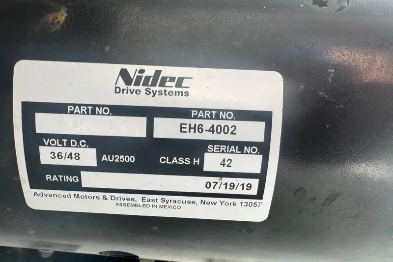 Slide: The Image of Label on Nidec Drive Systems motor, part number EH6-4002, for ElectraCraft 182TR, 2019. - 8