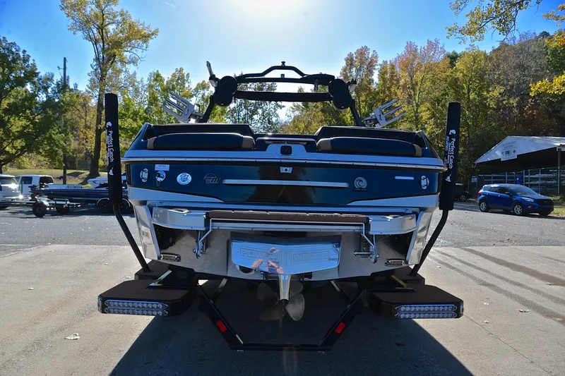 Slide: The Image of 2023 Malibu Wakesetter 23 LSV boat rear view in a sunny outdoor setting. - 13