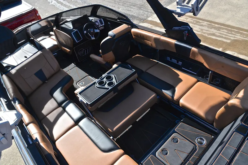 Slide: The Image of 2023 Malibu Wakesetter 23 LSV interior with luxurious seating and modern dashboard. - 20