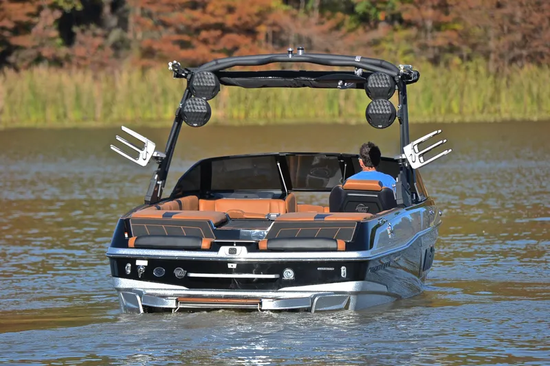 Slide: The Image of 2023 Malibu Wakesetter 23 LSV on a serene lake, showcasing luxury and performance. - 8