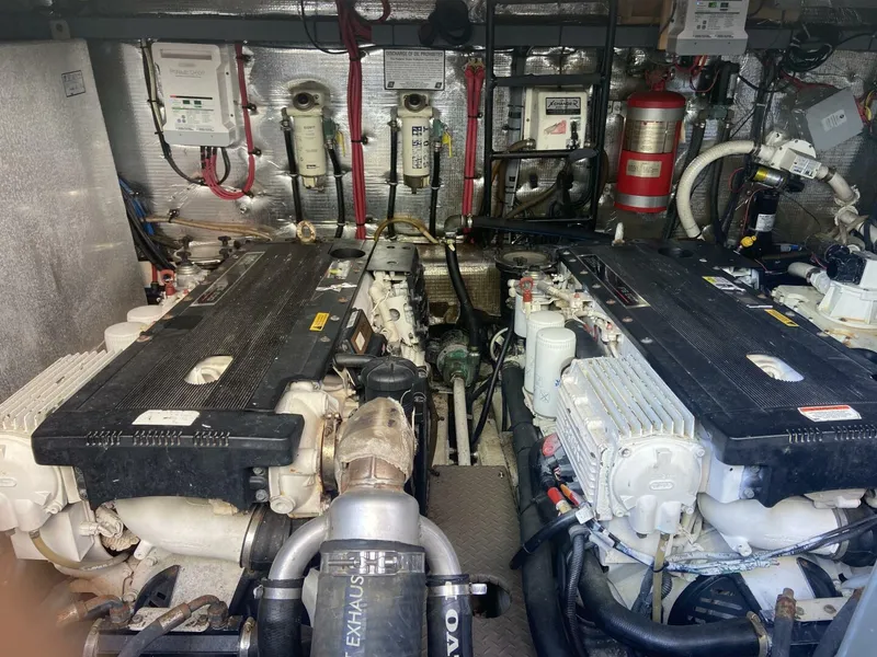 Slide: The Image of Engine room of a 2011 Regal 46 Sport Coupe with dual engines and equipment. - 17