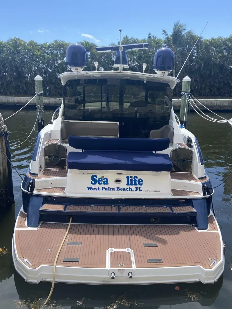 Slide: The Image of 2011 Regal 46 Sport Coupe docked, named "Sea-life," West Palm Beach, FL. - 4