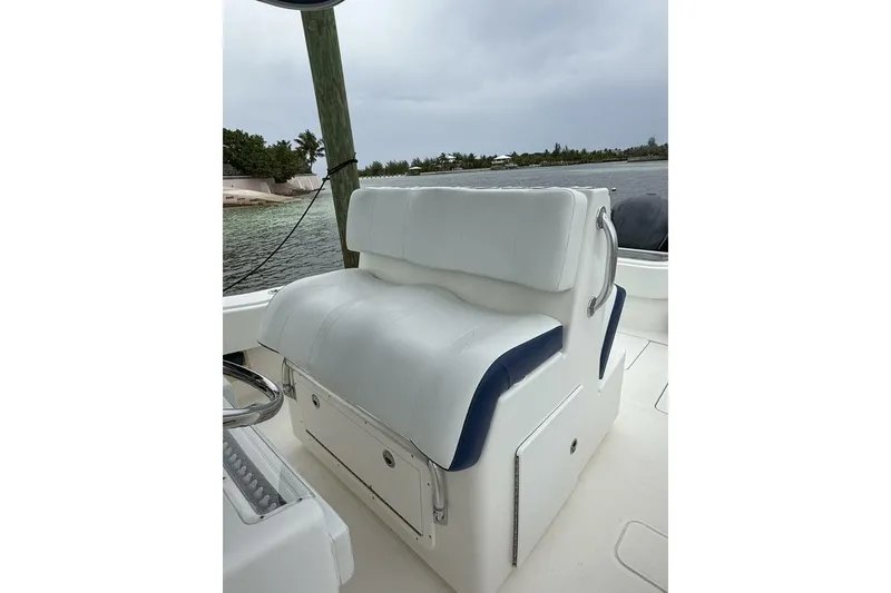 Slide: The Image of 2012 Invincible 36 Open Fisherman boat seat with white and blue upholstery. - 10
