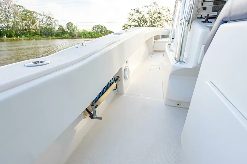 Slide: The Image of 2012 Invincible 36 Open Fisherman boat interior, featuring spacious deck and sleek design. - 14