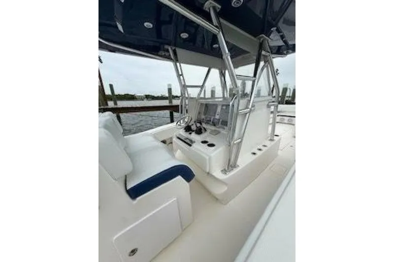 Slide: The Image of 2012 Invincible 36 Open Fisherman boat interior with helm and seating. - 9