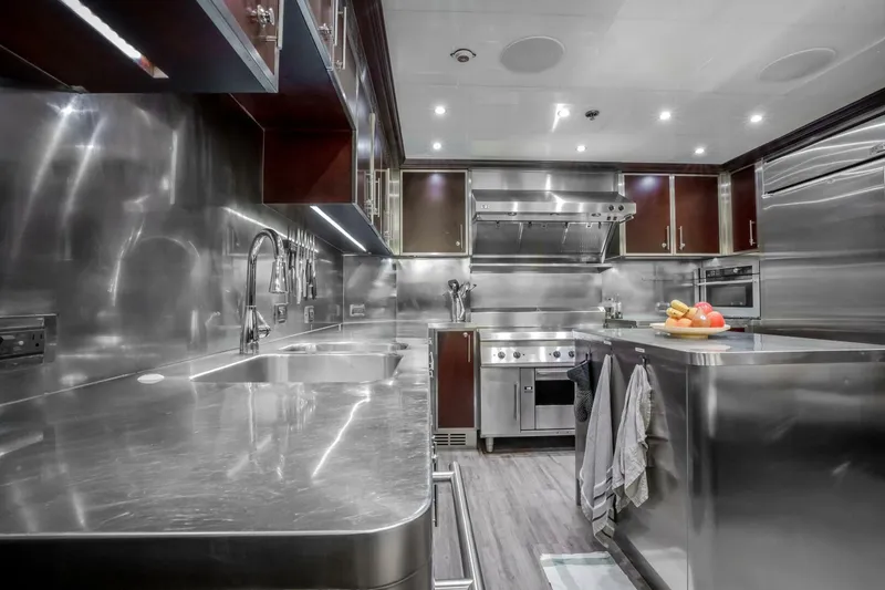 Slide: The Image of Luxurious stainless steel kitchen in 2009 Horizon Model Tri-Deck yacht, featuring modern appliances. - 10