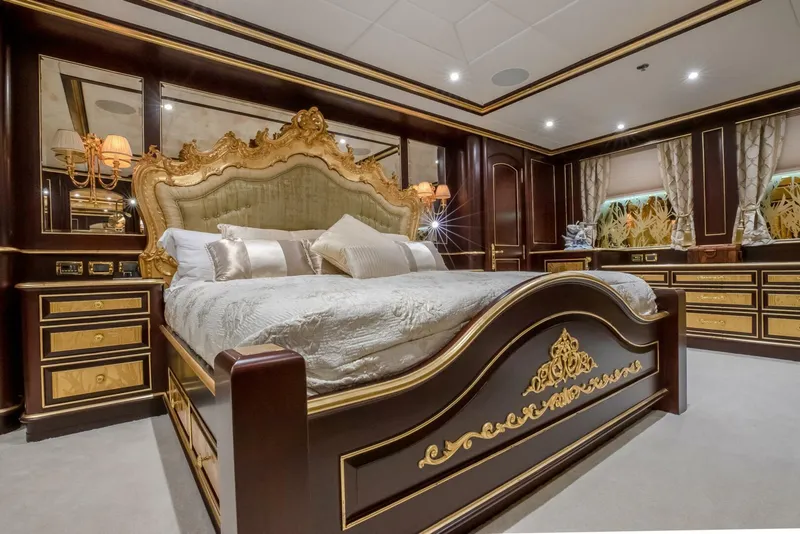 Slide: The Image of Luxurious bedroom with ornate bed and elegant decor on a 2009 Horizon Model Tri-Deck yacht. - 16