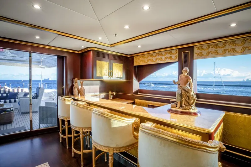 Slide: The Image of Luxurious yacht interior with elegant bar, ornate decor, and ocean view. Horizon Model Tri-Deck 2009. - 28