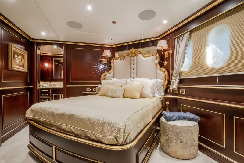 Slide: The Image of Luxurious bedroom on 2009 Horizon Model Tri-Deck yacht with elegant decor and plush bedding. - 34