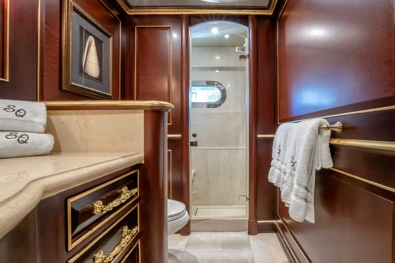 Slide: The Image of Luxurious yacht bathroom with rich wood paneling, elegant fixtures, and plush towels, Horizon Model Tri-Deck 2009. - 36