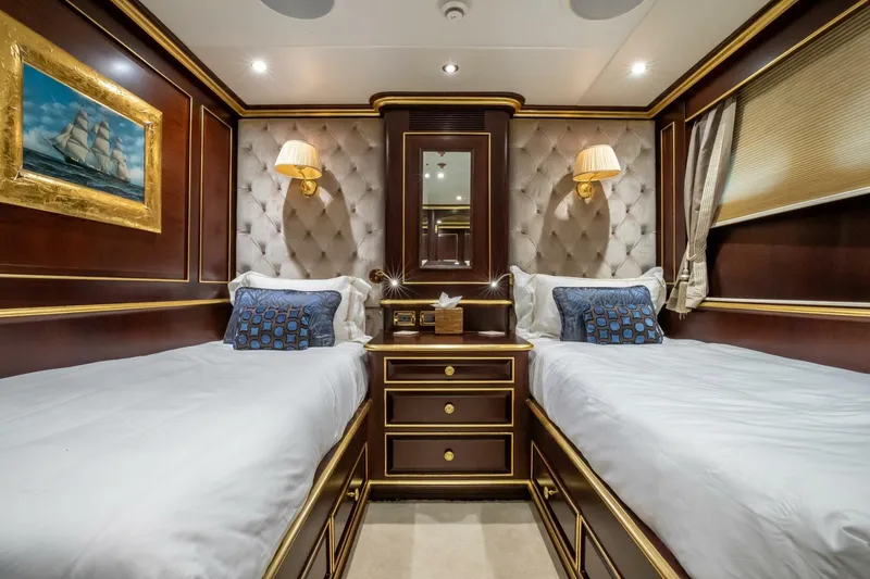 Slide: The Image of Luxurious twin cabin on 2009 Horizon Model Tri-Deck yacht with elegant wood paneling. - 42