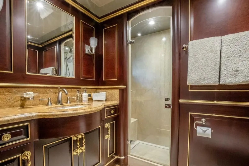 Slide: The Image of Luxurious yacht bathroom with wood paneling, glass shower, and elegant fixtures on Horizon Model Tri-Deck 2009. - 43