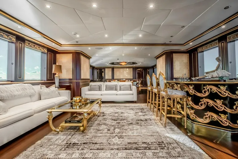 Slide: The Image of Luxurious yacht interior with elegant decor, featuring plush seating and ornate bar area, Horizon Model Tri-Deck 2009. - 6