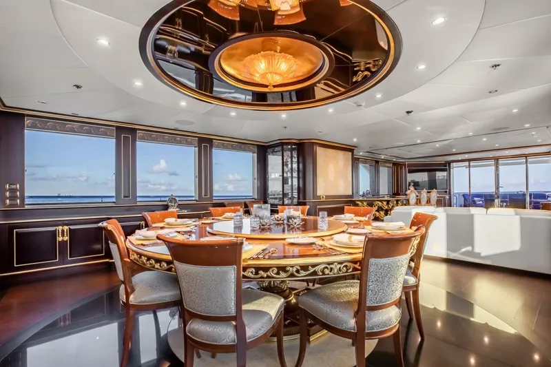 Slide: The Image of Luxurious dining area on 2009 Horizon Model Tri-Deck yacht with elegant decor and ocean views. - 7