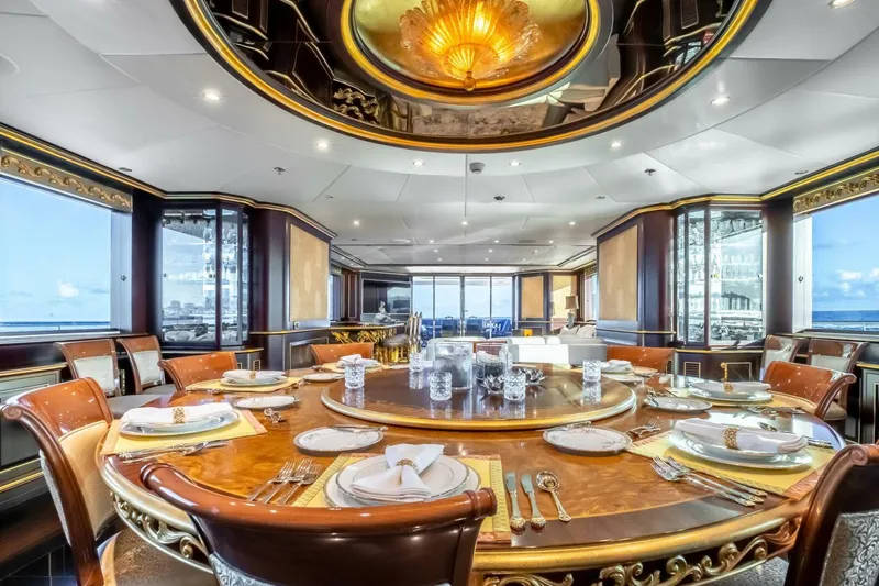Slide: The Image of Luxurious dining area on 2009 Horizon Model Tri-Deck yacht with elegant table setting. - 8