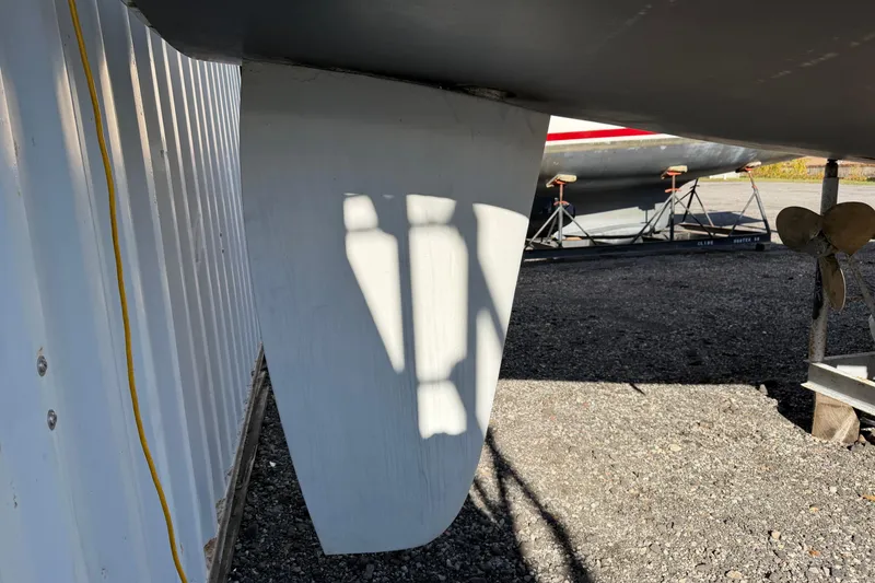 Slide: The Image of 2003 Hunter 44 Deck Salon sailboat keel and propeller in dry dock. - 10