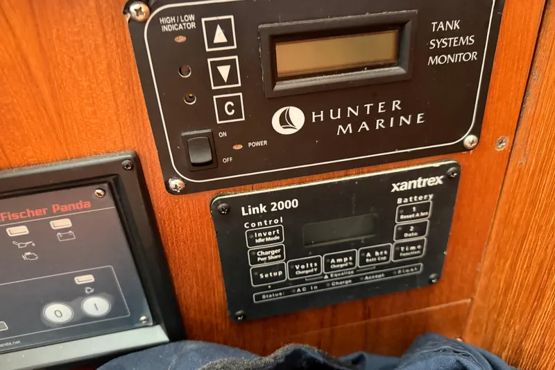 Slide: The Image of Control panels on a 2003 Hunter 44 Deck Salon yacht, featuring Hunter Marine and Xantrex systems. - 21
