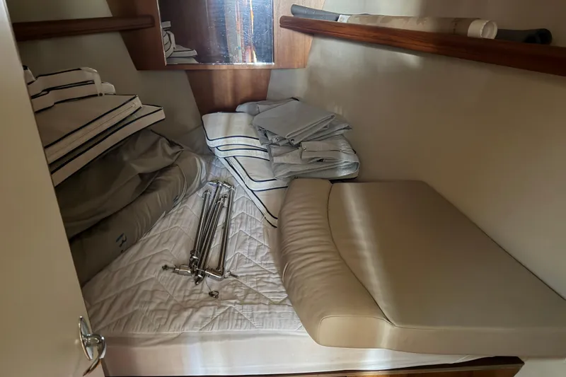 Slide: The Image of Interior cabin of 2003 Hunter 44 Deck Salon with cushions and folded linens. - 42