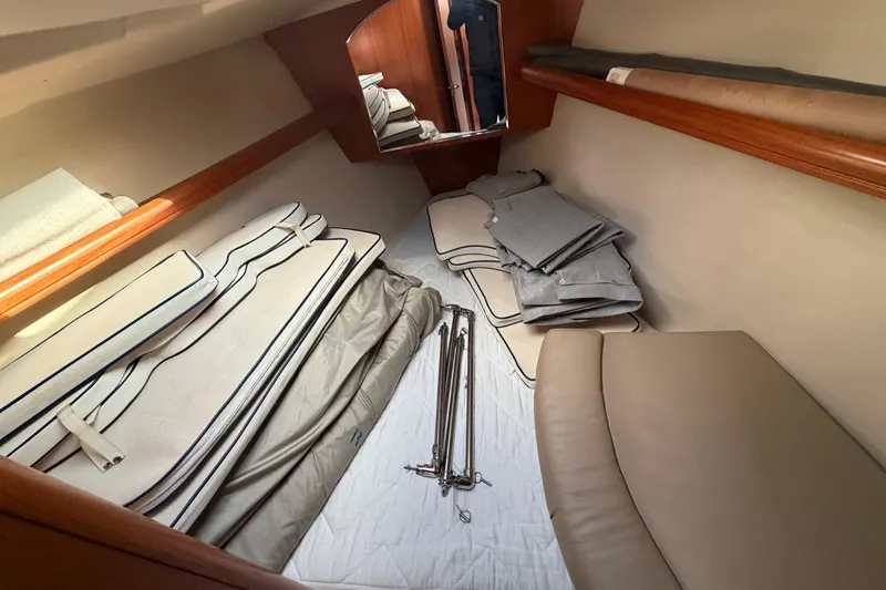 Slide: The Image of Interior cabin of 2003 Hunter 44 Deck Salon with cushions and folded covers. - 46