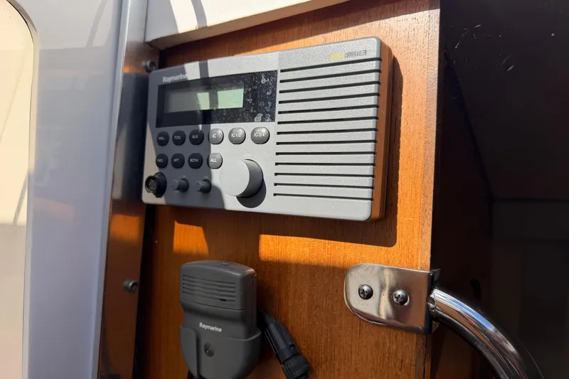 Slide: The Image of Raymarine radio system on 2003 Hunter 44 Deck Salon yacht, mounted on wooden panel. - 51
