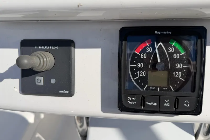 Slide: The Image of Control panel of 2003 Hunter 44 Deck Salon with thruster and Raymarine display. - 56