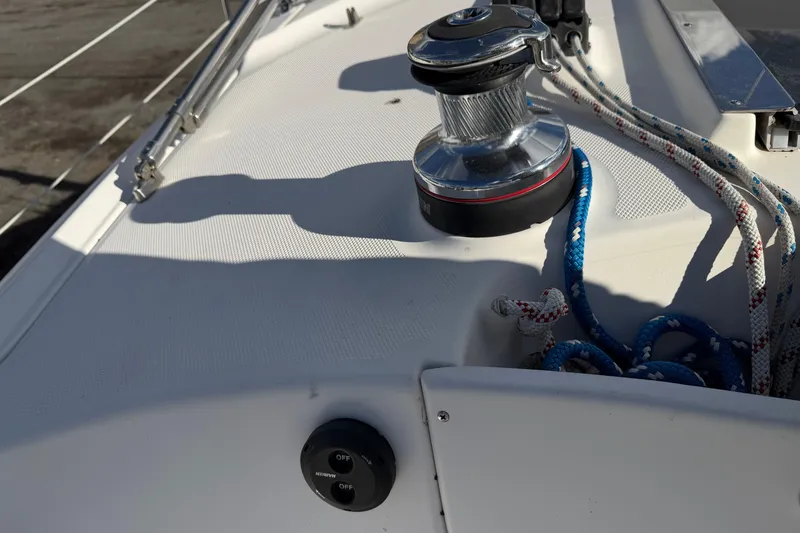 Slide: The Image of Deck view of 2003 Hunter 44 Deck Salon sailboat with winch and ropes. - 61