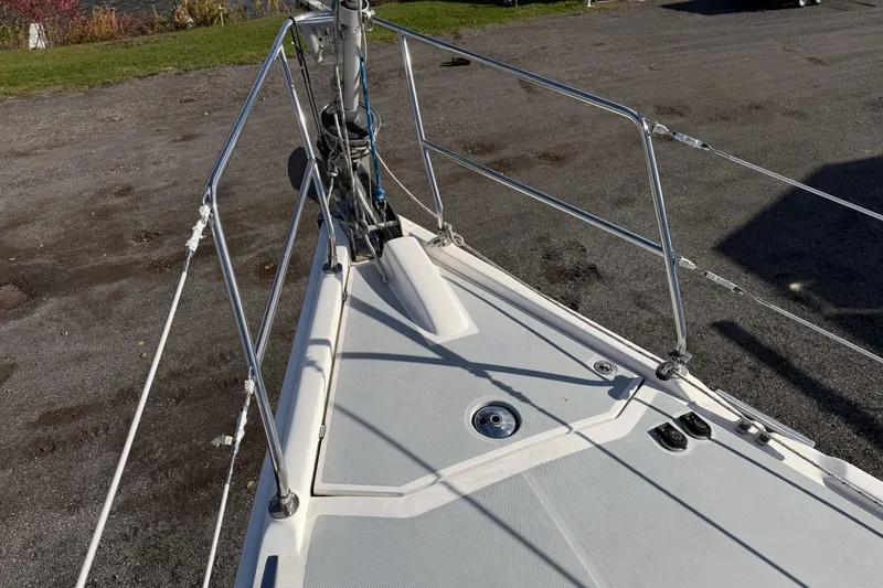 Slide: The Image of Bow view of a 2003 Hunter 44 Deck Salon sailboat on land. - 67