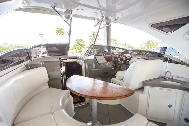 Slide: The Image of Interior of a 2008 Regal 38 yacht featuring a sleek seating area and modern helm. - 26