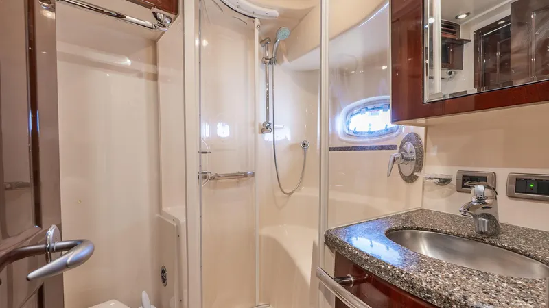 Slide: The Image of Luxurious bathroom in 2008 Sea Ray Sundancer yacht with granite countertop and shower. - 18
