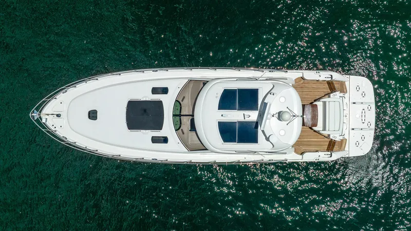 Slide: The Image of Aerial view of 2008 Sea Ray Sundancer yacht on clear water. - 36