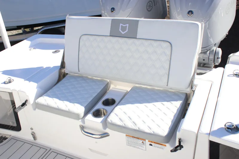 Slide: The Image of 2026 Sea Fox 282 Hybrid LT boat seating with cup holders and quilted cushions. - 20