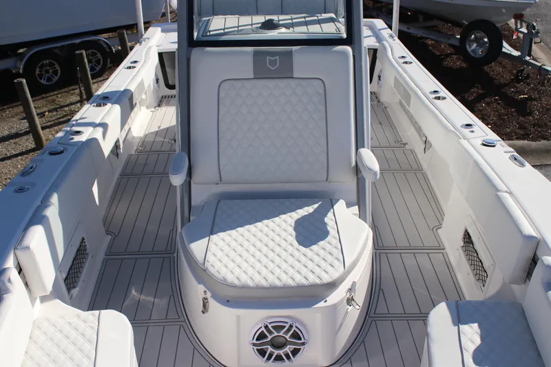 Slide: The Image of 2026 Sea Fox 282 Hybrid LT boat interior with cushioned seating and sleek design. - 24