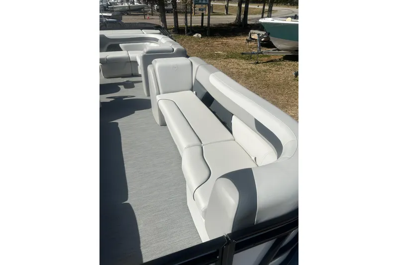 Slide: The Image of 2026 Godfrey Sweetwater 2286 Cruise Special Edition boat interior with plush seating. - 10